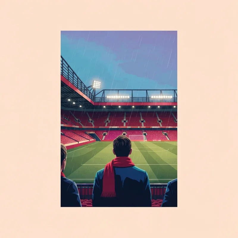 A lone fan at the stadium of Manchester United F.C. during a rainy evening.